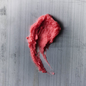 AMMO CRÈME high-carnauba car wax being applied with a microfiber applicator