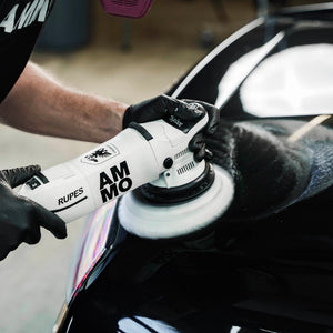 AMMO SHEER wool cutting pad attached to a dual action polisher
