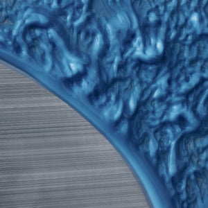 Close-up of blue textured material on a wooden surface